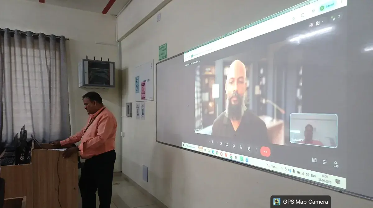 A remote facilitator projected on the classroom screen during the opening session
