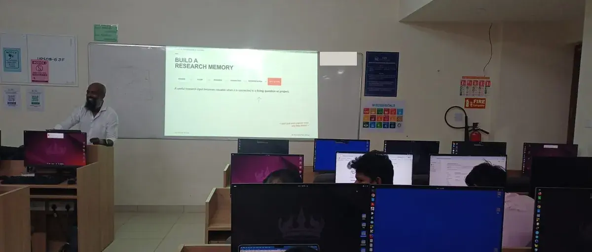 Moses presenting a research-memory workflow to faculty at computer workstations